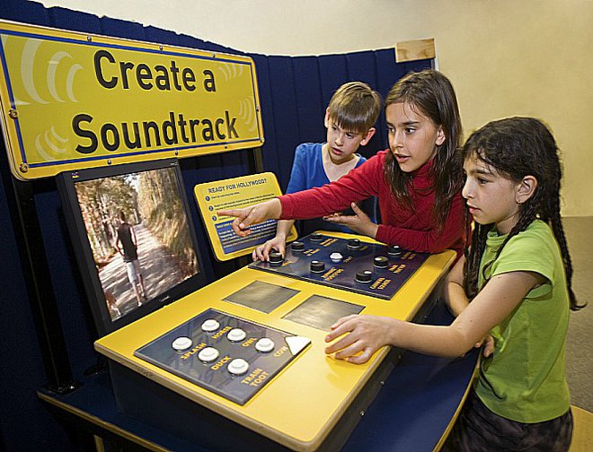 Children creating a soundtrack with exhibit component. 