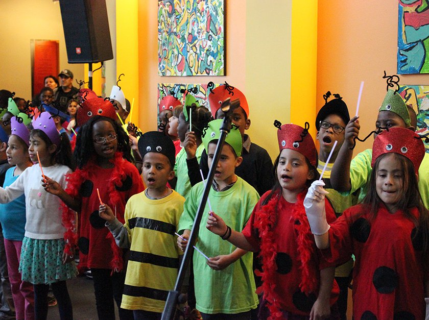 Children dressed up as different types of bugs. 