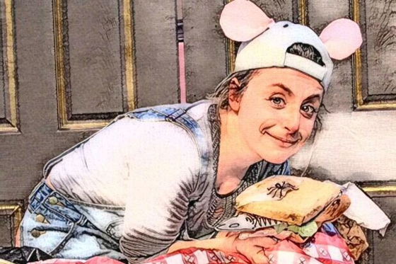 Image of an actor in Peter and the Pied Piper wearing a baseball hat with mouse ears on it.