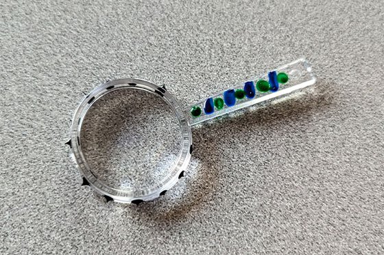 A plastic magnifying glass. 