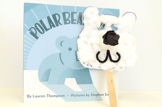The book "Polar Bear" with a crafted polar bear mask made of white cotton balls and paper. 