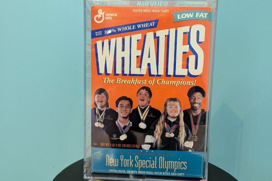 An old orange Wheaties cereal box featuring five Special Olympians. 