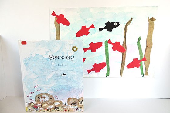 Book "Swimmy" with a picture of one black fish and many red fish in water. 