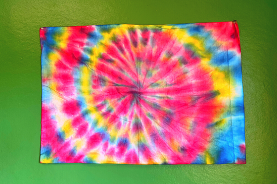 A multi-colored tie-dye pillowcase. 