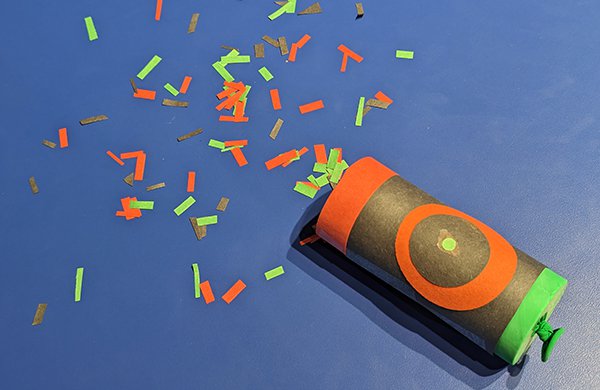 A confetti popper made from a paper rool and balloon with confetti inside. 