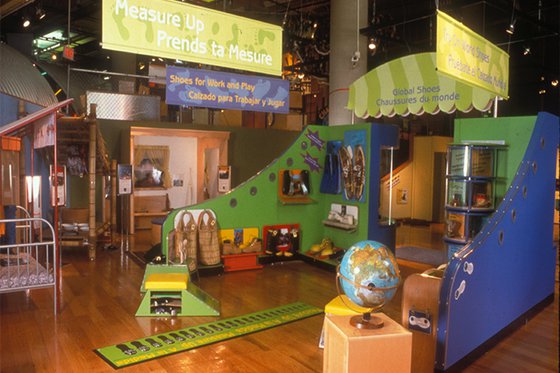 Display of various shoes and exhibit components. 