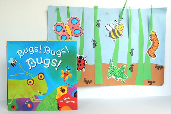 Book cover "Bugs! Bugs! Bugs" and craft of bugs on construction paper will tall paper blades of grass. 