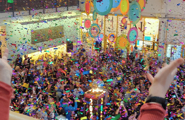 The Outer Lobby of LICM filled with people and confetti with a Time-Square style ball in the middle. 