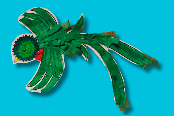 A graphic of a quetzal decorated with green and red tissue paper to mimic feathers.