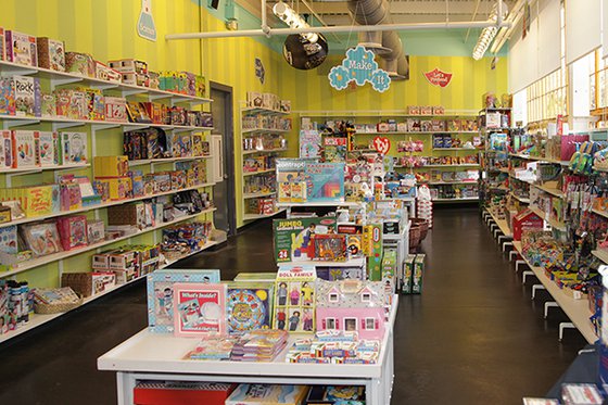 Museum Store shelves filled with toys, games and books. 