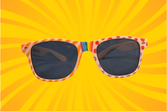 Hand-designed white sunglasses on a yellow spiral background. 