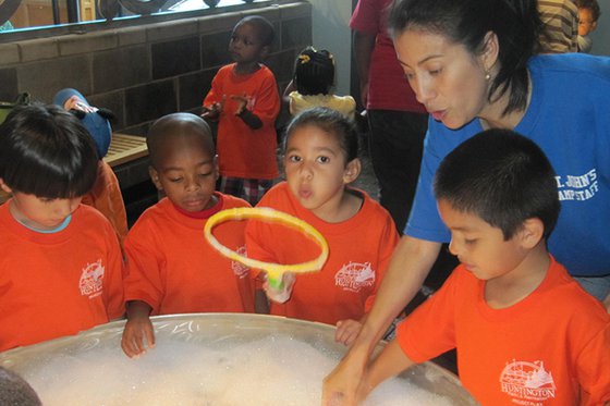 A camp group poses together at Long Island Children's Museum.