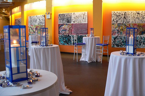 Guests mingling during an evening reception in the Museum atrium.