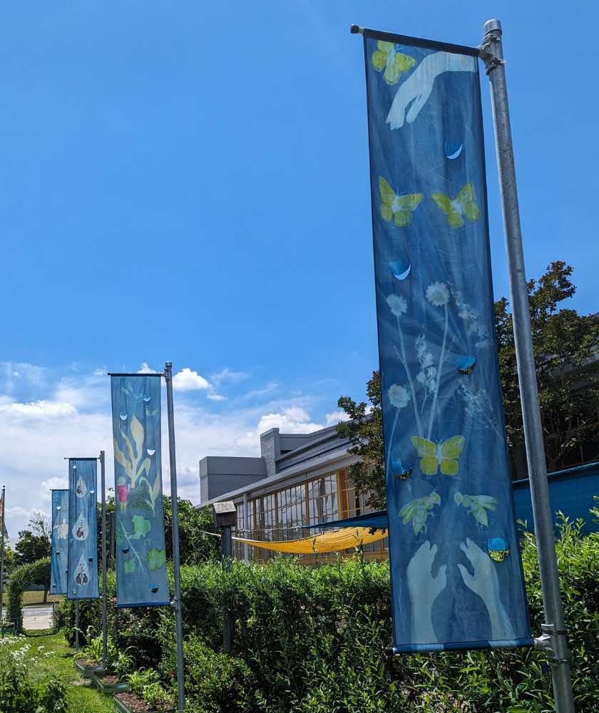 Silk banners by Ella Mahoney in the Our Backyard exhibit
