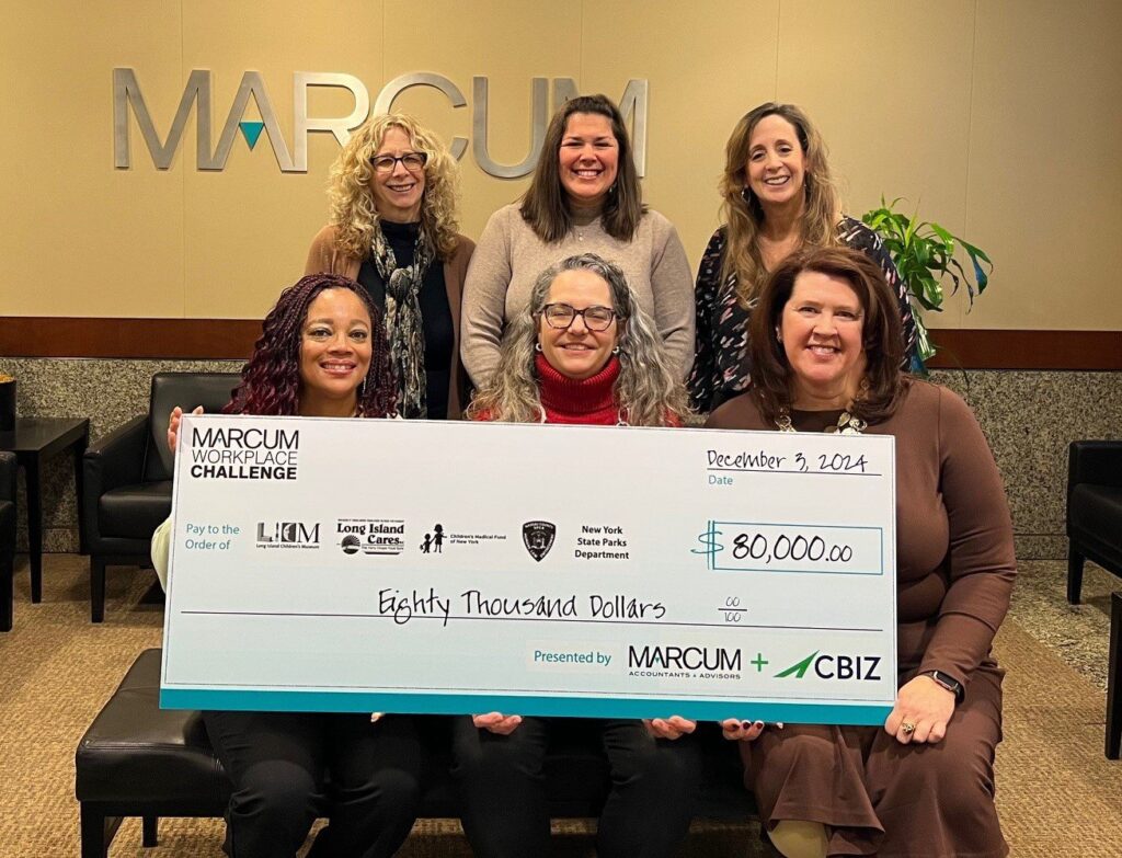 Representatives from Marcum and CBIZ present an $80,000 Marcum Workplace Challenge check to Long Island Children's Museum and fellow nonprofit partners.