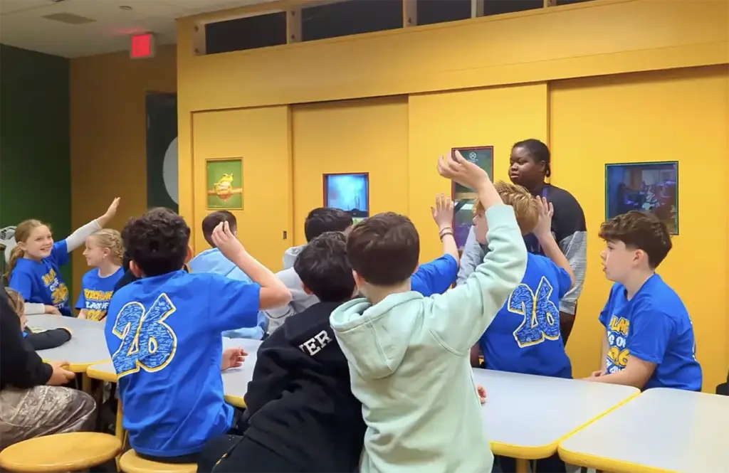 Students on a guided field trip explore an exhibit at Long Island Children's Museum.